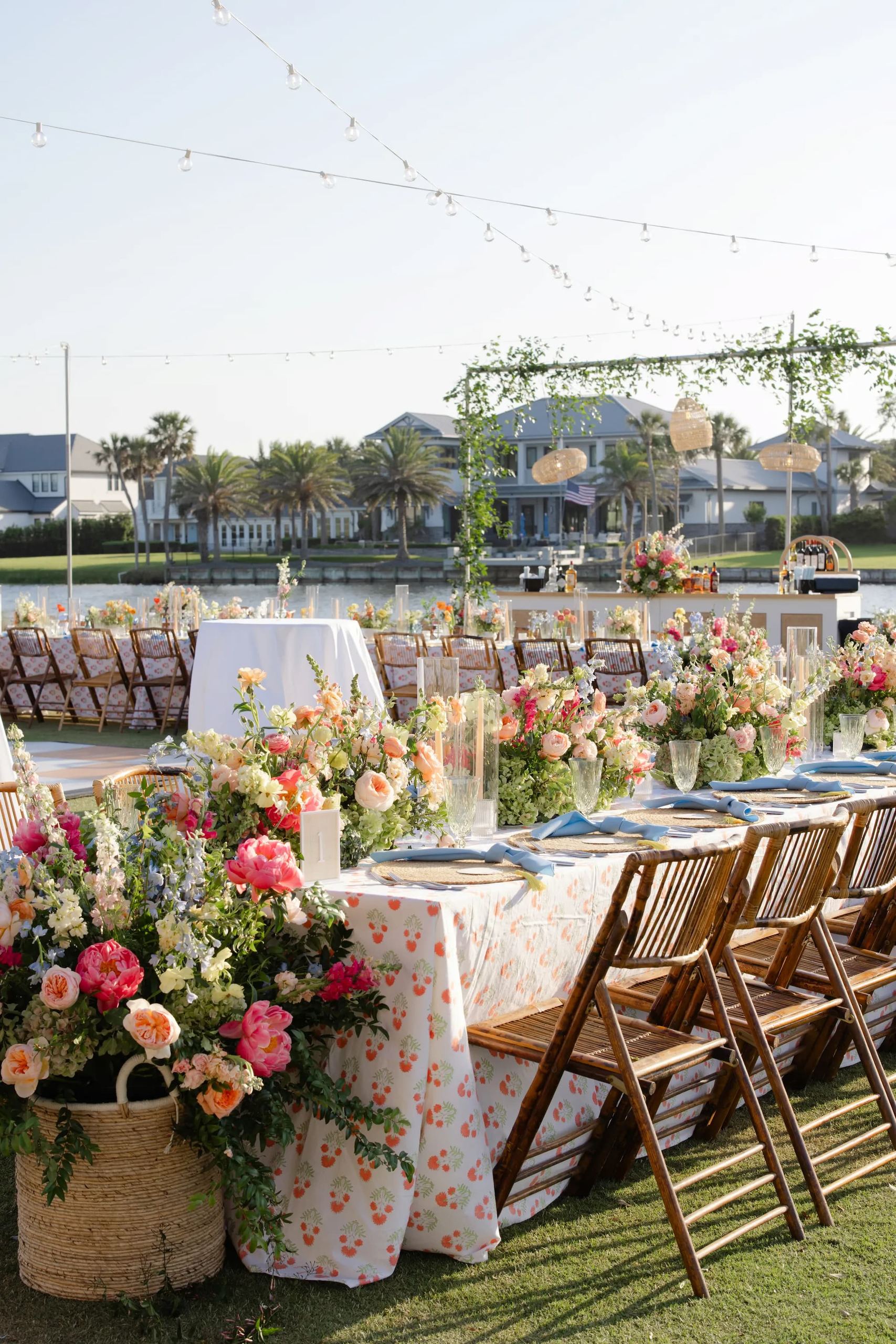 Waterfront table in a coral marigold block print with cornflower napkins