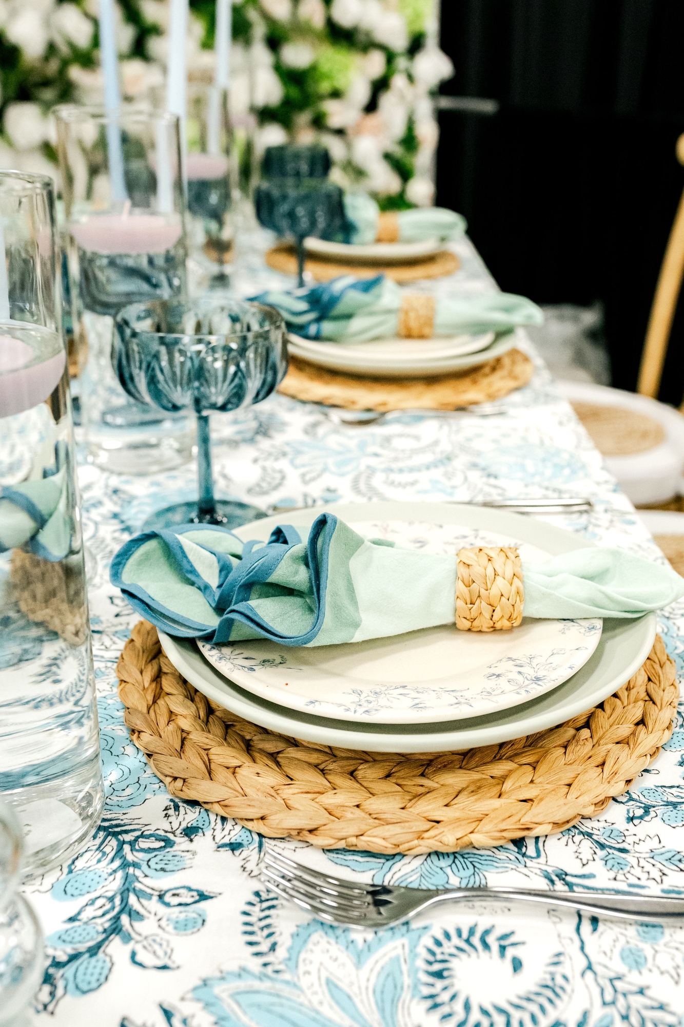 Place setting in blue block print with sage and denim napkins
