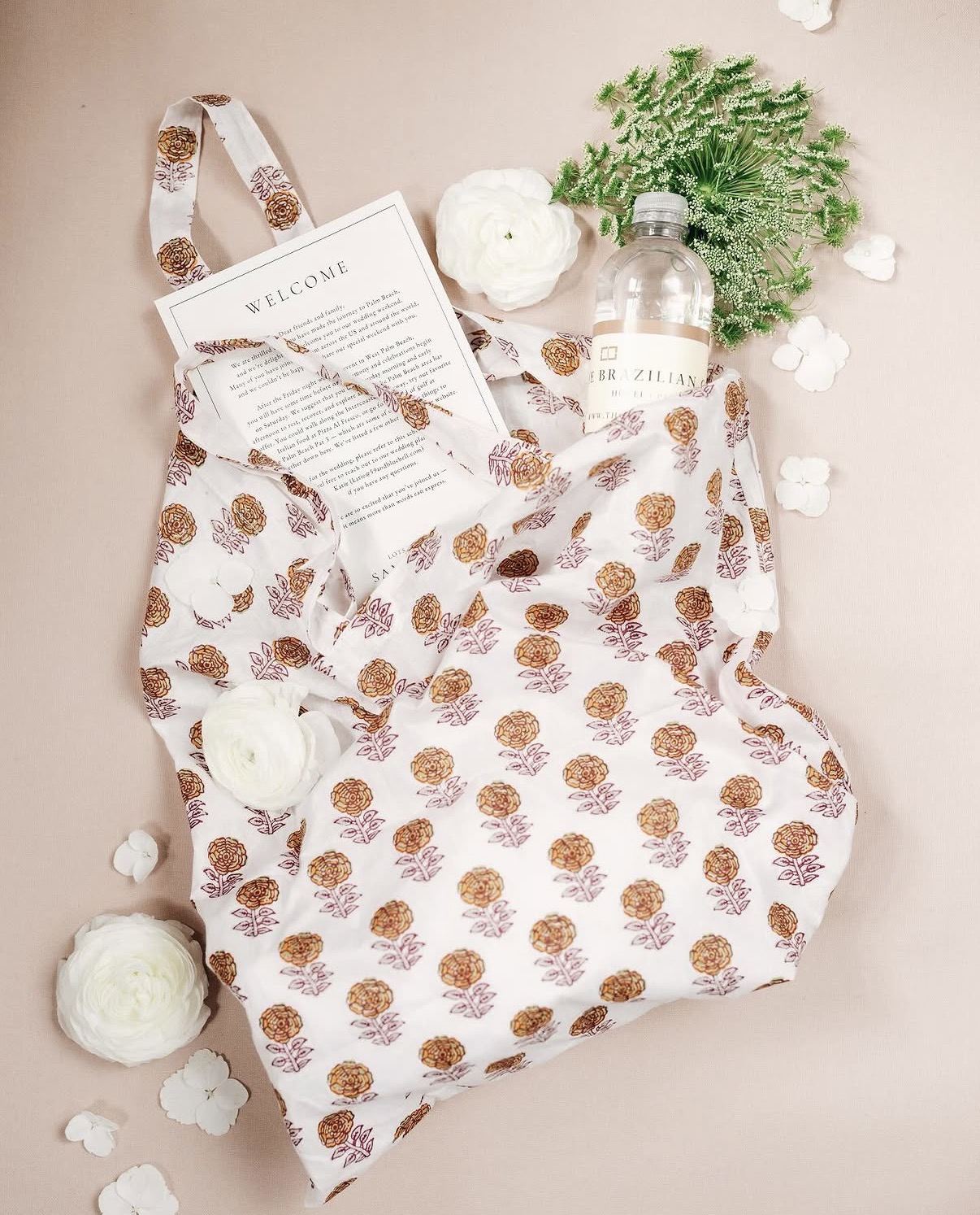 Block-printed marigold welcome tote with a printed welcome letter