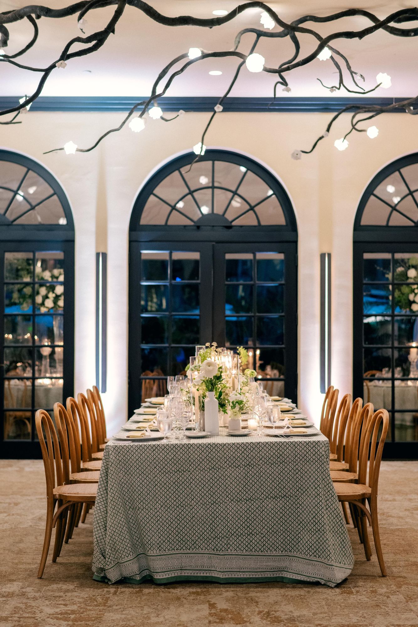 Long table under a green block-printed cloth with a wide printed border